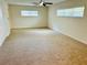 Bright living room with neutral carpeting and large windows at 2811 Valencia S Way, St Petersburg, FL 33705