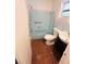 Retro bathroom with light blue tile and shower/tub combo at 2811 Valencia S Way, St Petersburg, FL 33705