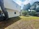 Spacious backyard with grassy area and mature trees at 2811 Valencia S Way, St Petersburg, FL 33705