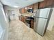 Bright kitchen with stainless steel appliances and wood cabinets at 2811 Valencia S Way, St Petersburg, FL 33705