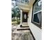 Front door entrance with steps leading up to a covered porch at 2811 Valencia S Way, St Petersburg, FL 33705
