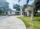 Two-story house with a long driveway and mature landscaping at 2811 Valencia S Way, St Petersburg, FL 33705