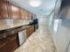 Open concept kitchen with stainless steel appliances and view to dining area at 2811 Valencia S Way, St Petersburg, FL 33705
