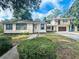 Two story home with attached garage and landscaping at 2811 Valencia S Way, St Petersburg, FL 33705