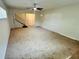 Large living room with neutral carpeting and stairs at 2811 Valencia S Way, St Petersburg, FL 33705
