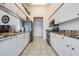 Bright kitchen, granite countertops, stainless steel appliances, and ample cabinet space at 1044 Blyth Hill Ct, Trinity, FL 34655
