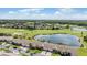 Aerial view of homes near a lake and golf course at 1044 Blyth Hill Ct, Trinity, FL 34655