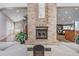 Inviting lobby with a large brick fireplace and comfortable seating at 1044 Blyth Hill Ct, Trinity, FL 34655