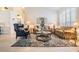 Living Room with light flooring, comfortable seating, and a coffee table at 1044 Blyth Hill Ct, Trinity, FL 34655