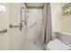 Accessible bathroom with walk-in shower and safety features at 1044 Blyth Hill Ct, Trinity, FL 34655