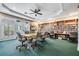 Well-lit library with a variety of books and comfortable seating at 1044 Blyth Hill Ct, Trinity, FL 34655
