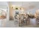 Dining area with hardwood floors, chandelier, and view of living room at 1044 Blyth Hill Ct, Trinity, FL 34655