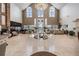 Bright and airy lobby with large windows and seating at 1044 Blyth Hill Ct, Trinity, FL 34655