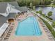 Community pool with surrounding patio and lounge chairs at 1044 Blyth Hill Ct, Trinity, FL 34655