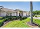 Brick home with lush landscaping and palm tree accents at 1044 Blyth Hill Ct, Trinity, FL 34655