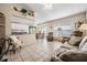 Open living room with tile floors and access to kitchen and dining area at 1044 Blyth Hill Ct, Trinity, FL 34655