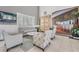 Lobby sitting area with comfortable seating and storage at 1044 Blyth Hill Ct, Trinity, FL 34655