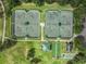 Community tennis courts, bocce ball, and a view of surrounding homes at 1044 Blyth Hill Ct, Trinity, FL 34655