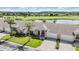 Two-story home with attached garage, front yard, and golf course views at 1044 Blyth Hill Ct, Trinity, FL 34655