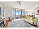 Living area with hardwood floors, water views and comfortable seating at 5823 Bowen Daniel Dr # 905, Tampa, FL 33616
