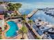 Relaxing pool area next to a marina with yachts at 5823 Bowen Daniel Dr # 905, Tampa, FL 33616