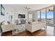 Spacious living room with water views and comfortable seating at 5823 Bowen Daniel Dr # 905, Tampa, FL 33616
