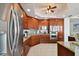 Modern kitchen with dark wood cabinets and stainless steel appliances at 5823 Bowen Daniel Dr # 905, Tampa, FL 33616