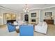 Community lounge with comfortable seating and fireplace at 5823 Bowen Daniel Dr # 905, Tampa, FL 33616