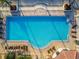 Resort-style swimming pool with surrounding lounge chairs at 5823 Bowen Daniel Dr # 905, Tampa, FL 33616