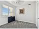Bright bedroom with window, TV, and neutral carpeting at 5823 Bowen Daniel Dr # 905, Tampa, FL 33616