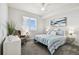 Guest bedroom with window and comfortable bedding at 5823 Bowen Daniel Dr # 905, Tampa, FL 33616