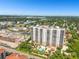 Aerial view of a luxury high-rise building and pool at 5823 Bowen Daniel Dr # 905, Tampa, FL 33616