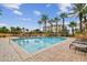 Resort-style pool with lounge chairs and patio area at 5823 Bowen Daniel Dr # 905, Tampa, FL 33616