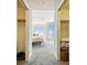 Hallway with view of bedroom and closets at 5823 Bowen Daniel Dr # 905, Tampa, FL 33616