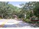Gated community entrance with guardhouse and signage at 379 Fan Palm Ne Ct # 0, St Petersburg, FL 33703