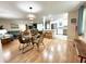 Open concept dining area with glass table and wicker chairs at 5750 80Th N St # C108, St Petersburg, FL 33709