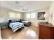 Guest bedroom with twin beds and hardwood floors at 5750 80Th N St # C108, St Petersburg, FL 33709