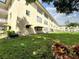 Building exterior with manicured lawn and covered parking at 5750 80Th N St # C108, St Petersburg, FL 33709