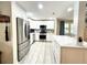 Updated kitchen with stainless steel appliances and quartz countertops at 5750 80Th N St # C108, St Petersburg, FL 33709
