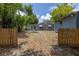 View of backyard from between wooden fences at 5609 20Th S Ave, Gulfport, FL 33707