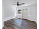 Light-filled bedroom with ceiling fan and exterior access at 5609 20Th S Ave, Gulfport, FL 33707