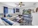 Bright living room with comfy seating, a fireplace, and a large TV at 5609 20Th S Ave, Gulfport, FL 33707