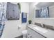 Clean bathroom with gray vanity, updated fixtures at 5609 20Th S Ave, Gulfport, FL 33707