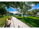 Pathway through Rosselli Park, showing benches and landscaping at 169 Sun Isle Cir # 33, Treasure Island, FL 33706