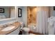 Bathroom with tub, shower, and granite vanity at 5500 Gulf Blvd # 7253, St Pete Beach, FL 33706