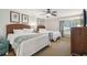 Well-lit guest bedroom with two double beds and a ceiling fan at 36750 Us Highway 19 N # 13202, Palm Harbor, FL 34684