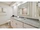 Bathroom with granite vanity and large mirror at 36750 Us Highway 19 N # 13202, Palm Harbor, FL 34684