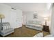 Guest bedroom with a striped sofa and a nightstand at 36750 Us Highway 19 N # 13202, Palm Harbor, FL 34684