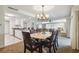 Elegant dining room features a chandelier and seating for six at 36750 Us Highway 19 N # 13202, Palm Harbor, FL 34684
