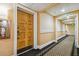 Hotel hallway with carpet and wood doors at 36750 Us Highway 19 N # 13202, Palm Harbor, FL 34684